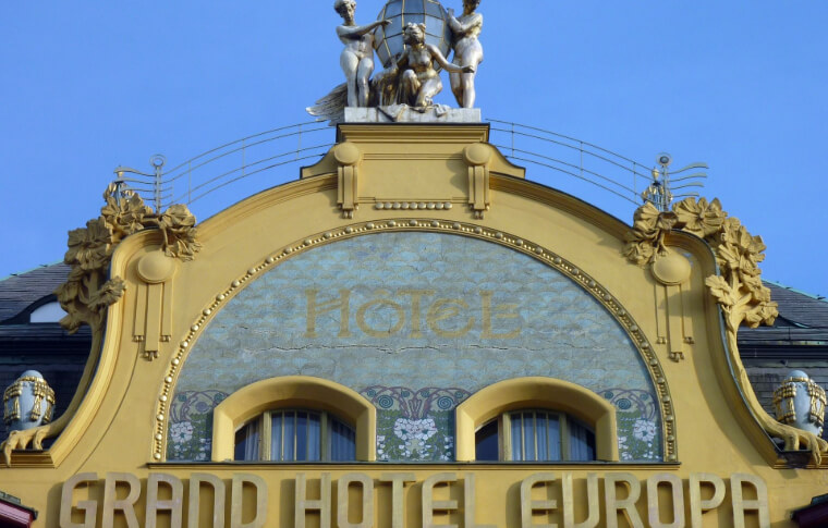 edifice of gold and green curvy building