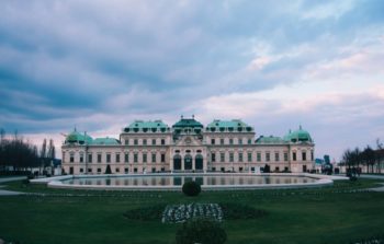 Belvedere Palace with a fountain and gardens in front.