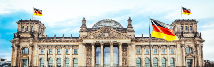 The Reichstag building with German flags