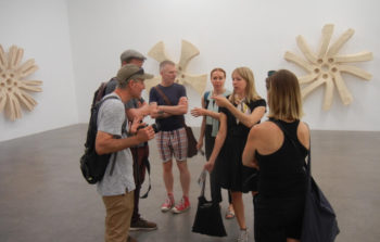 A tourist group in an art gallery