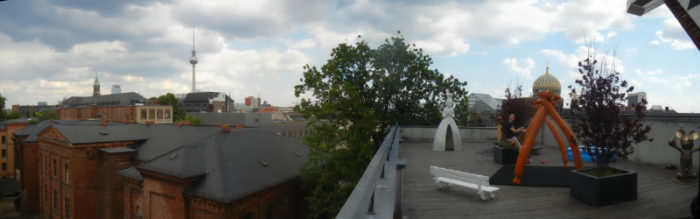 A rooftop gallery with sculptures.