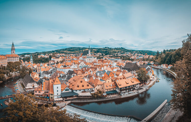 overview of medieval town with red roofs and white walls