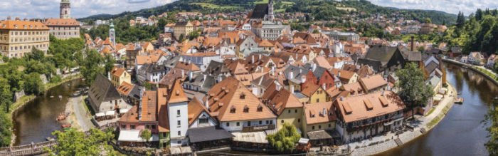 overview of medieval town with red roofs and white walls