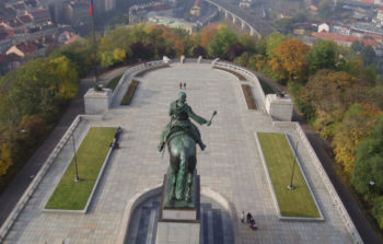 aerial view of sculpture of man on horse overlooking square in a park