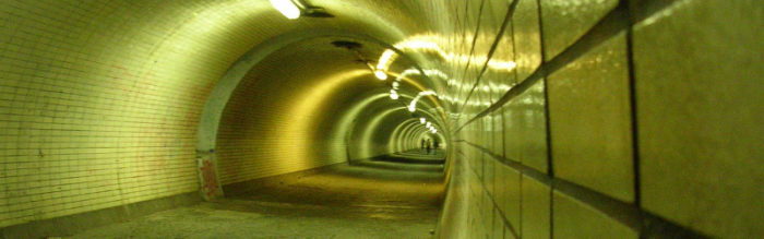 Reflected lights in a tiled tunnel