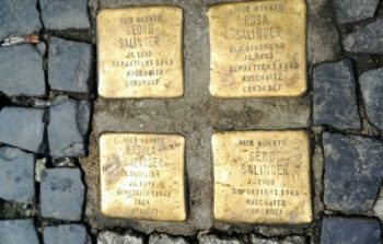 Stolpersteine memorials engraved in between the street cobbles.