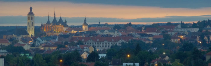 skyline of medieval town with orange roofs at sunset