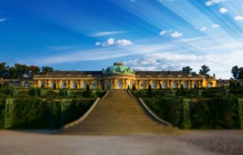 grand outdoor staircase leading to wide palace