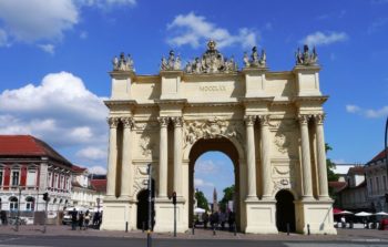 military memorial gate with statues on top