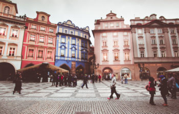 old square with various buildings of pink red and blue