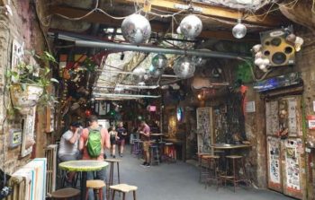 Disco balls hang from the roof of a ruin bar.