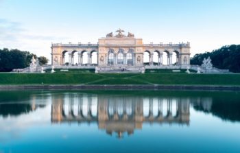 large gate monument reflected on water