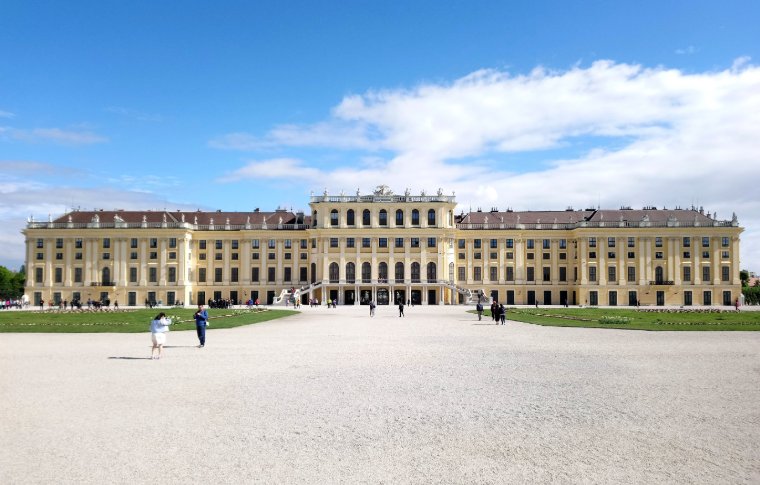 large palace with yellow walls and many windows