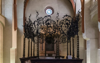 interior of synagogue with intricate metal work columns