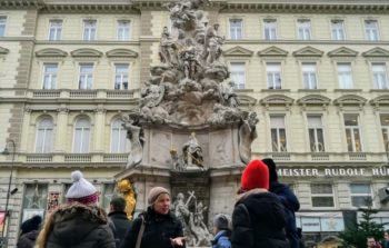 walking tour in front of a water fountain in Vienna