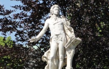 Statue in Vienna in front of a tree