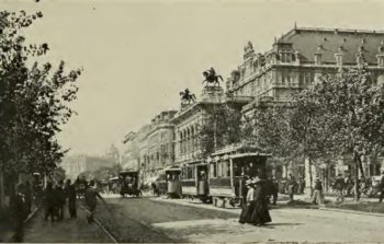 A black and white photo of Vienna with trams.