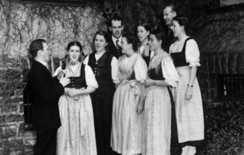 black and white photo of family singing